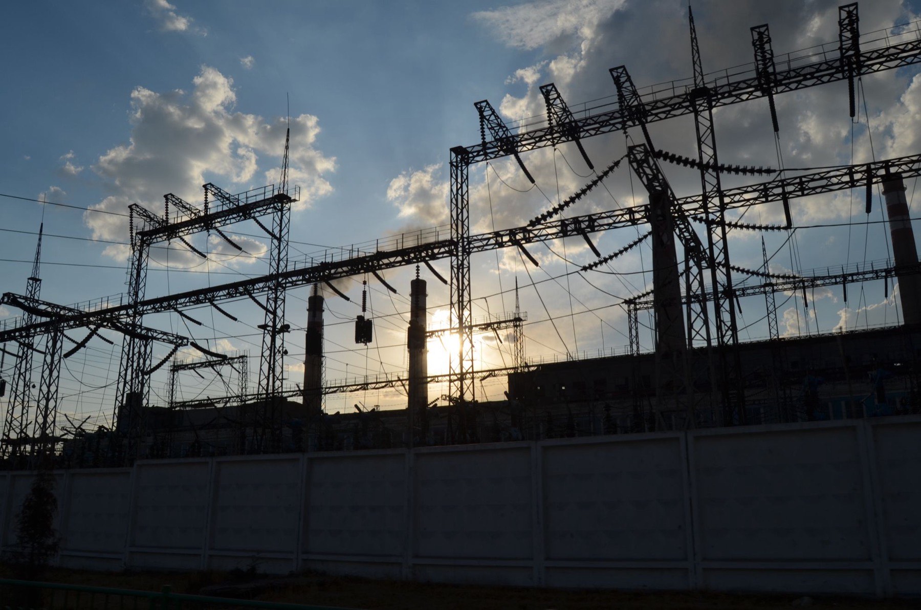 High-voltage substation at dusk on Ferrock AI powered land