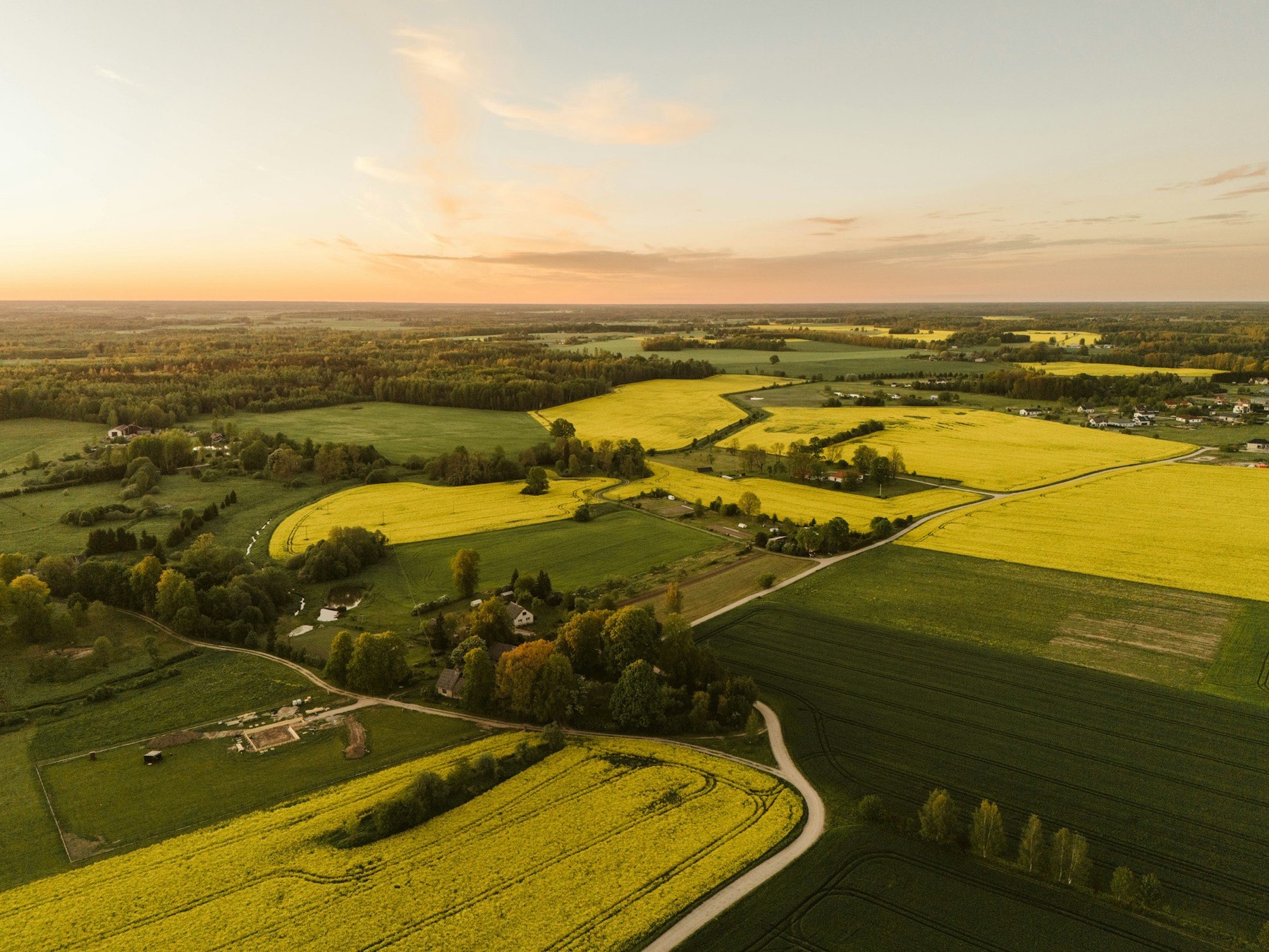 Aerial view of open plains under transmission corridors
